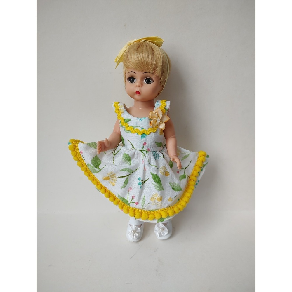 Madame Alexander‎ blonde doll in yellow outfit